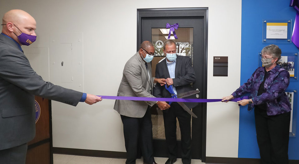 Joshua Hagen, dean of the College of Letters and Science; Chancellor Thomas Gibson; Ray Ackerlund, president of Skyward; and Cindy McCabe, head of the Department of Mathematical Sciences, help open the new Skyward Internship Center at UW-Stevens Point.