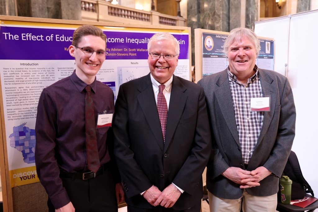Junior Kyle Pulvermacher with UW System President Jay Rothman and Professor of Economics Scott Wallace