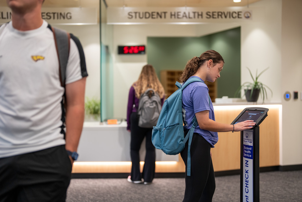 Student using self check in at UWSP student health services