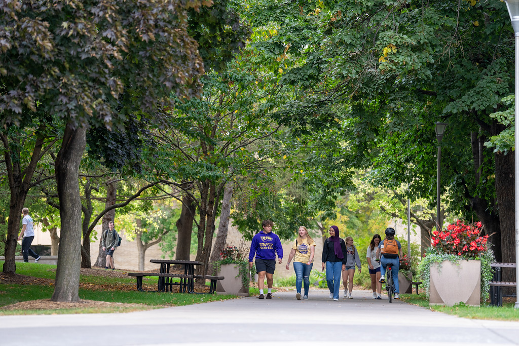 students walking though campus
