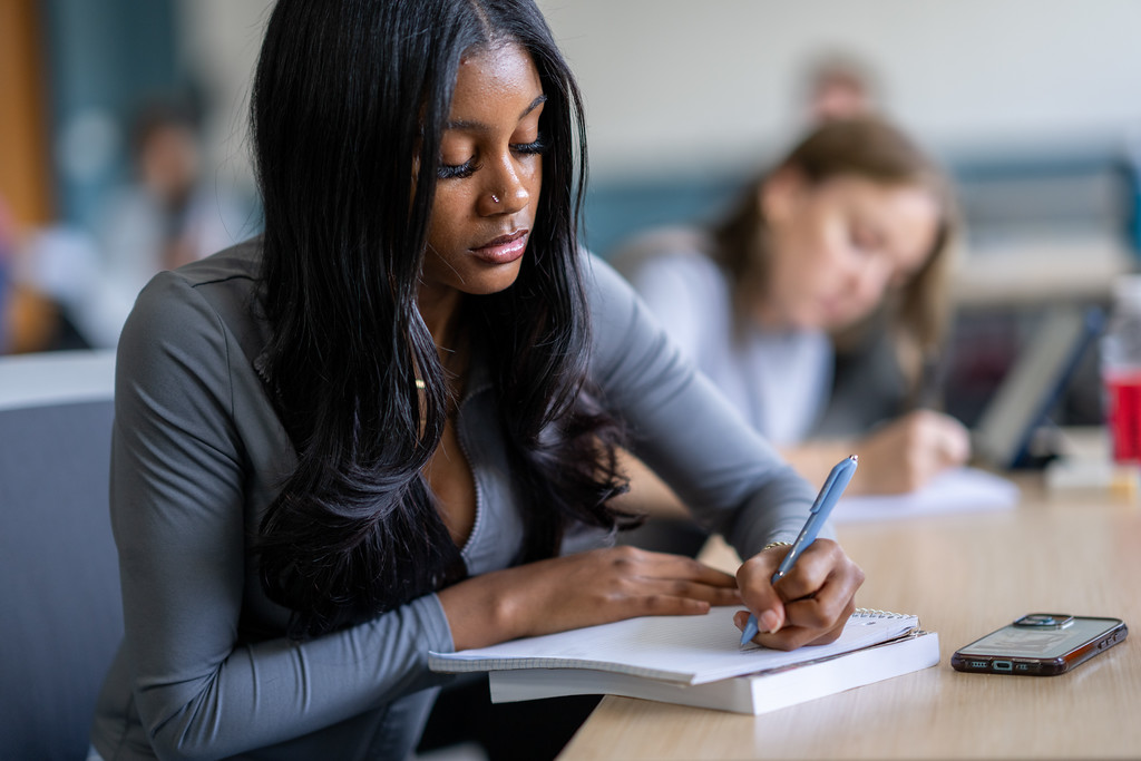 Student taking notes