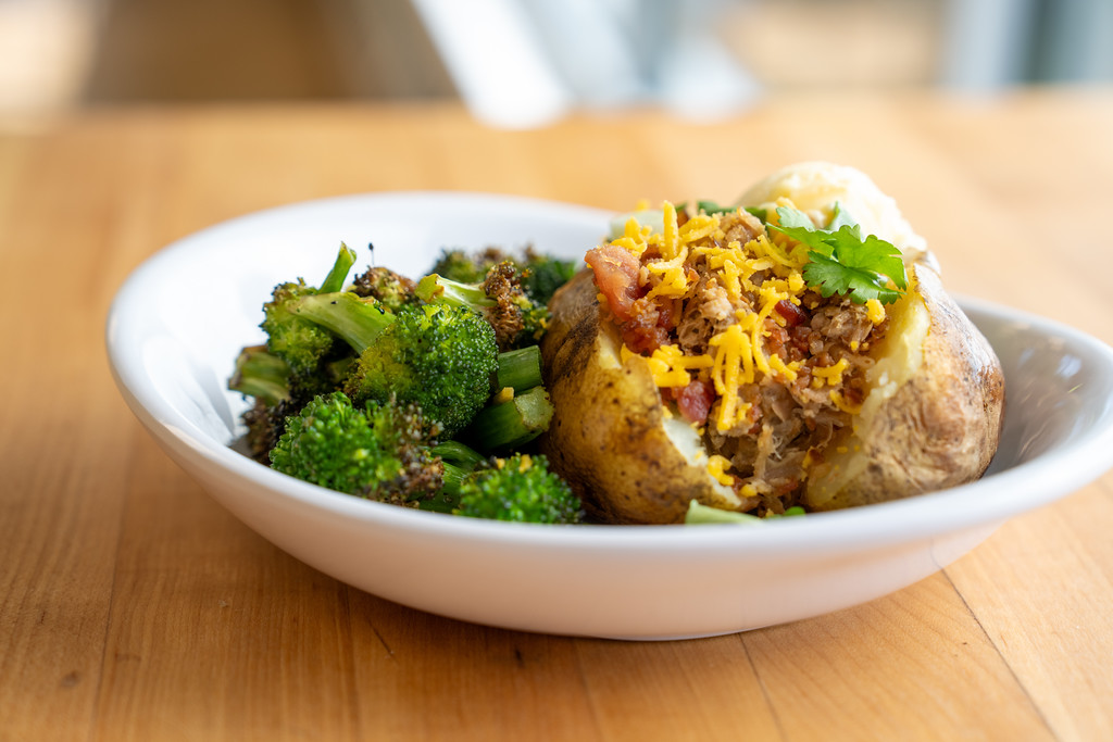 Plate with broccoli and a baked potato