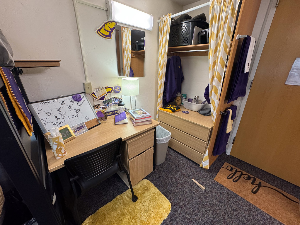 Sample dorm room at UWSP with desk and dresser shown